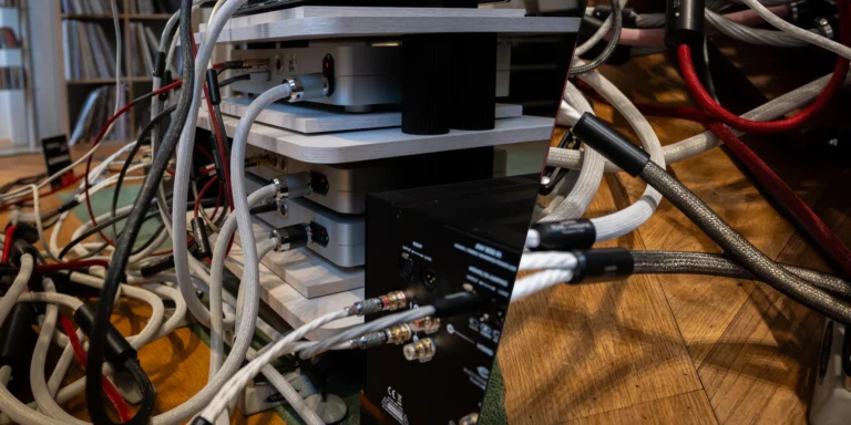 Audio cable routing around components in a hi-fi system.
