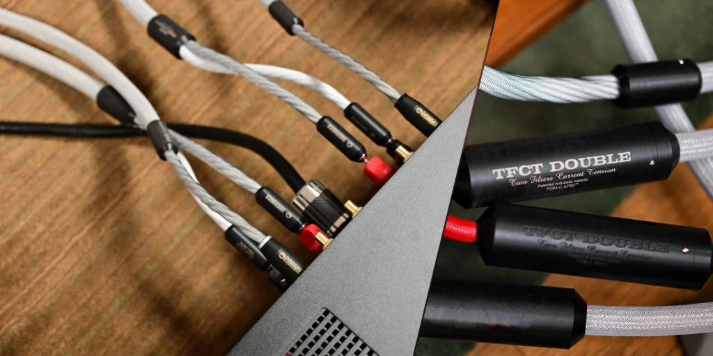 Cables and cable modules arranged around audio equipment.